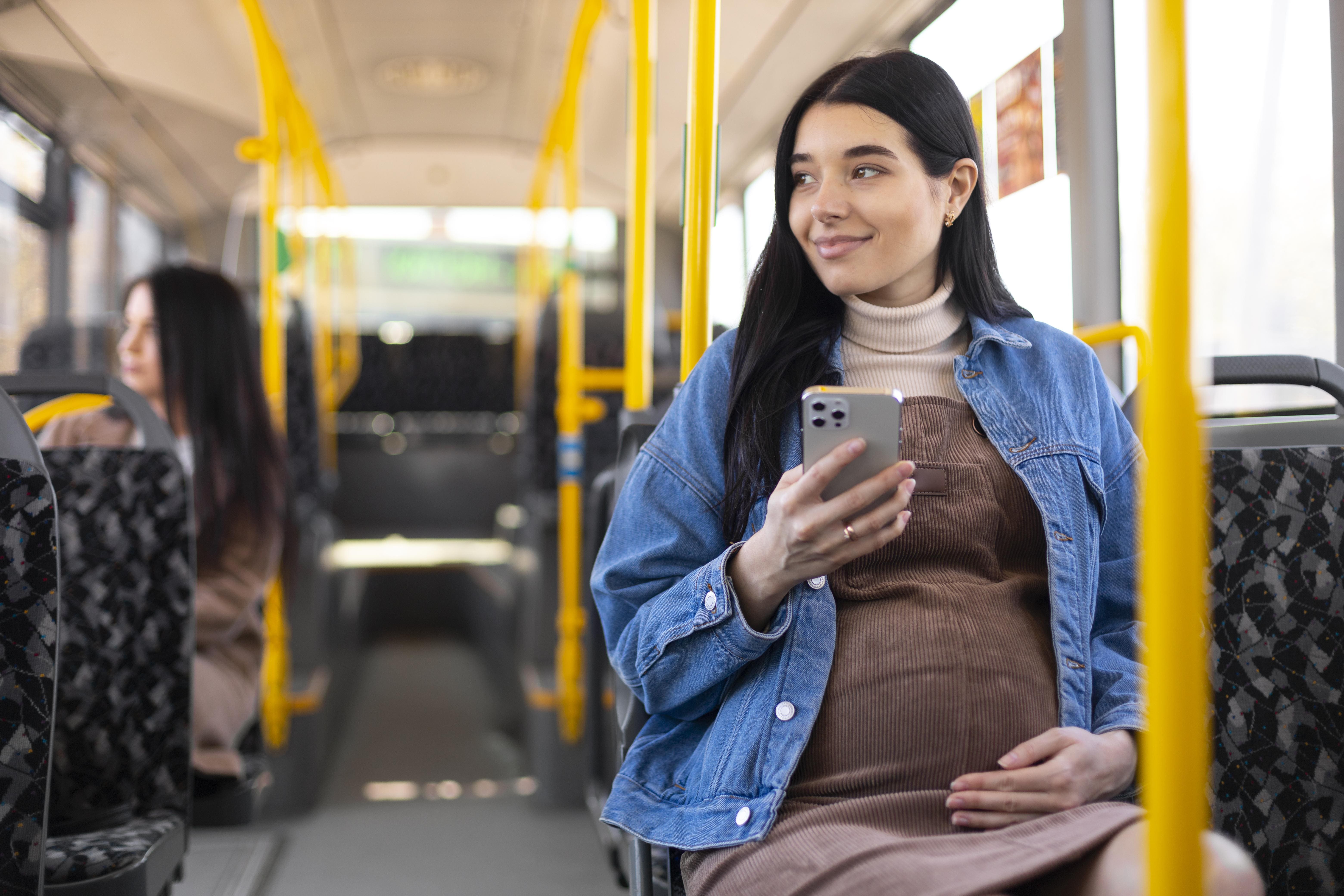 Pregnant Women travelling Comfortably in Bus